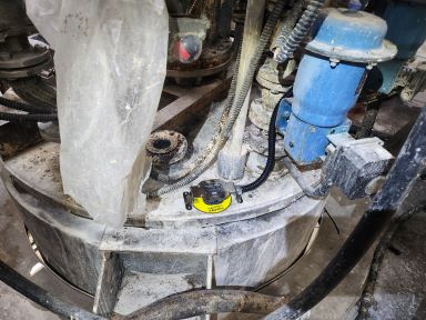Leak detector sensor installed below the wet-strength resin storage tank