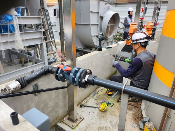 Sensor piping installation for hazardous chemical leak detection at an outdoor storage tank